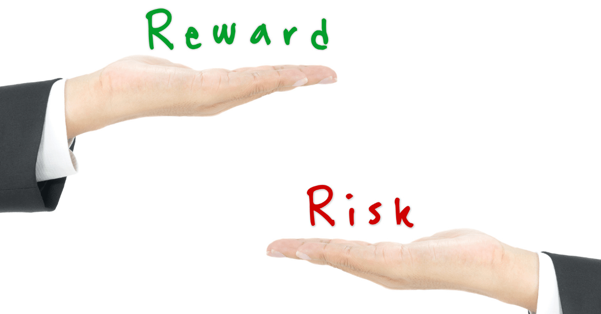 two hands with one hand labelled reward and the other risk