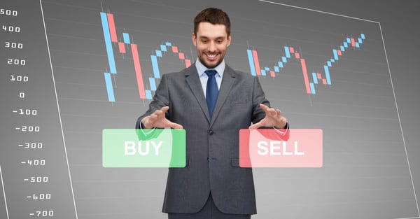 man_standing_over_a_forex_chart_projection_deciding_between_buy_and_sell