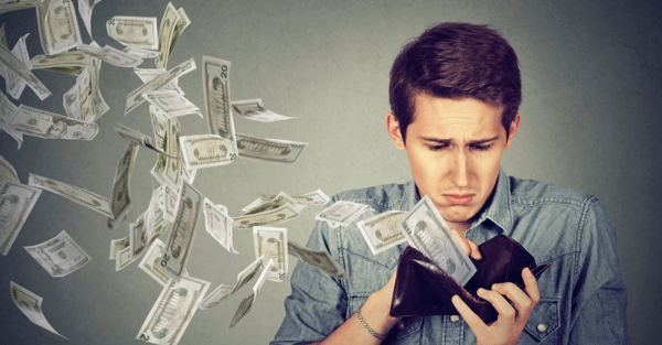 sad_man_looking_at_his_wallet_with_money_dollar_banknotes_flying_out_away